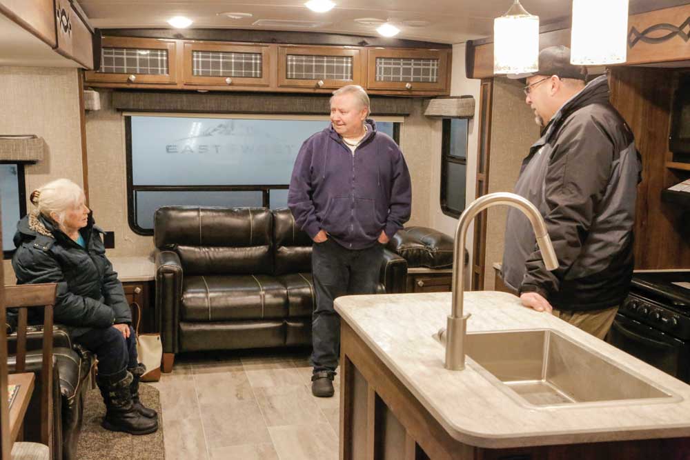 RV shoppers check out the interior of an RV RV shoppers check out the interior of an RV