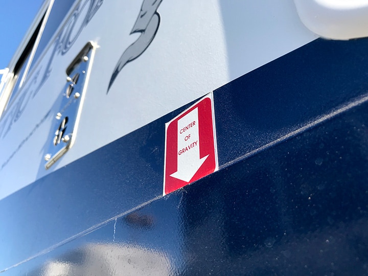 Arrow decal on truck camper showing center of gravity location