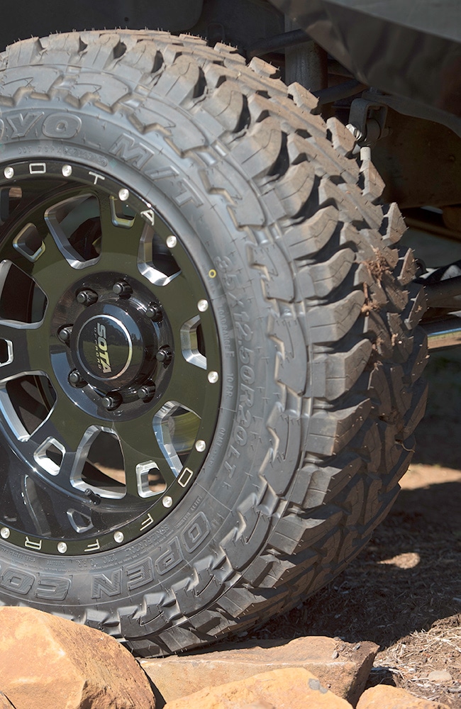 Close-up of light truck tire on truck.