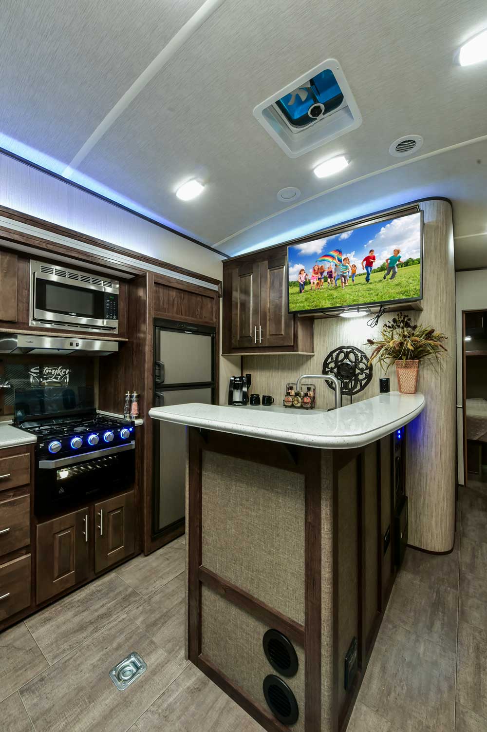 Galley area of Cruiser-stryker Toy Hauler RV also shows tv