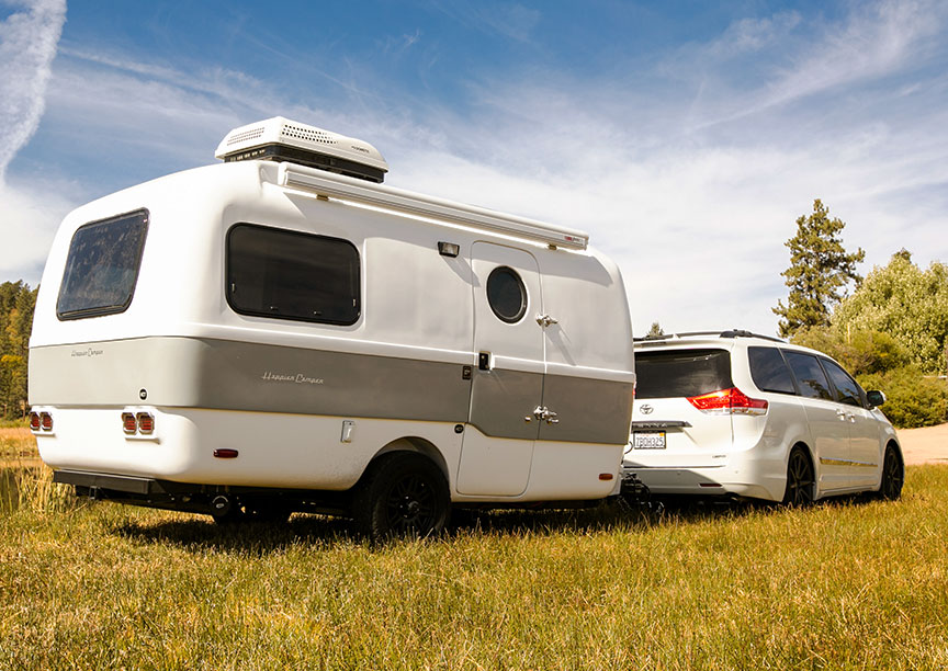 HCT trailer and Toyota Sierra minivan White minivan towing HCT trailer