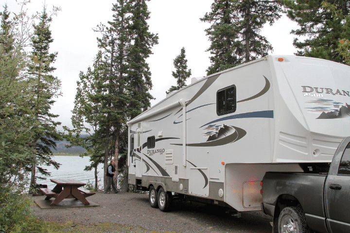 At British Columbia's Muncho Lake Provincial Park, RVers lay claim to a lakeside site at Strawberry Flats Campground.