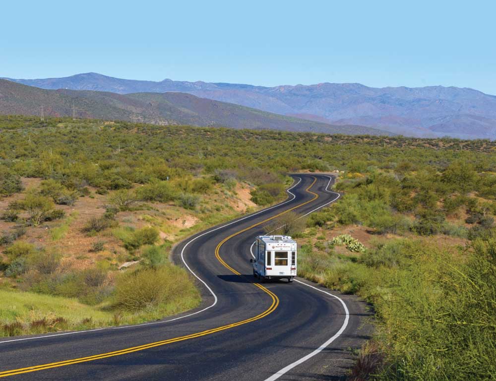 Photo of RV on curvy road demonstrates diagonal line composition.