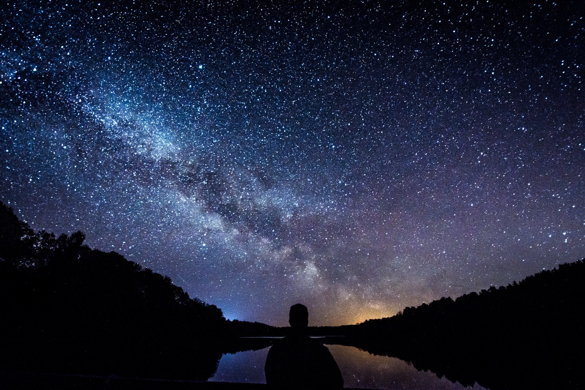 A man stargazing on a starry night