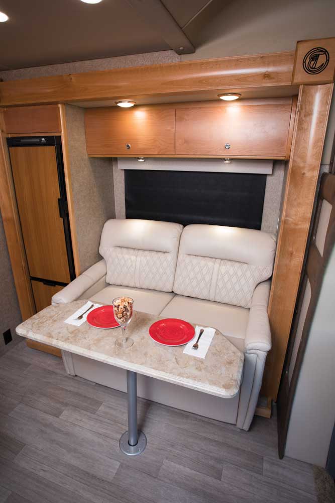 The cozy two-person sofa tucked into the slideout offers additional sleeping accommodations for guests.