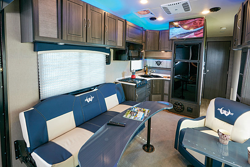 The Weekend Warrior 28W is a model of space efficiency. Interior seating includes one large and two smaller couches, twin easy chairs and dual removable tables.