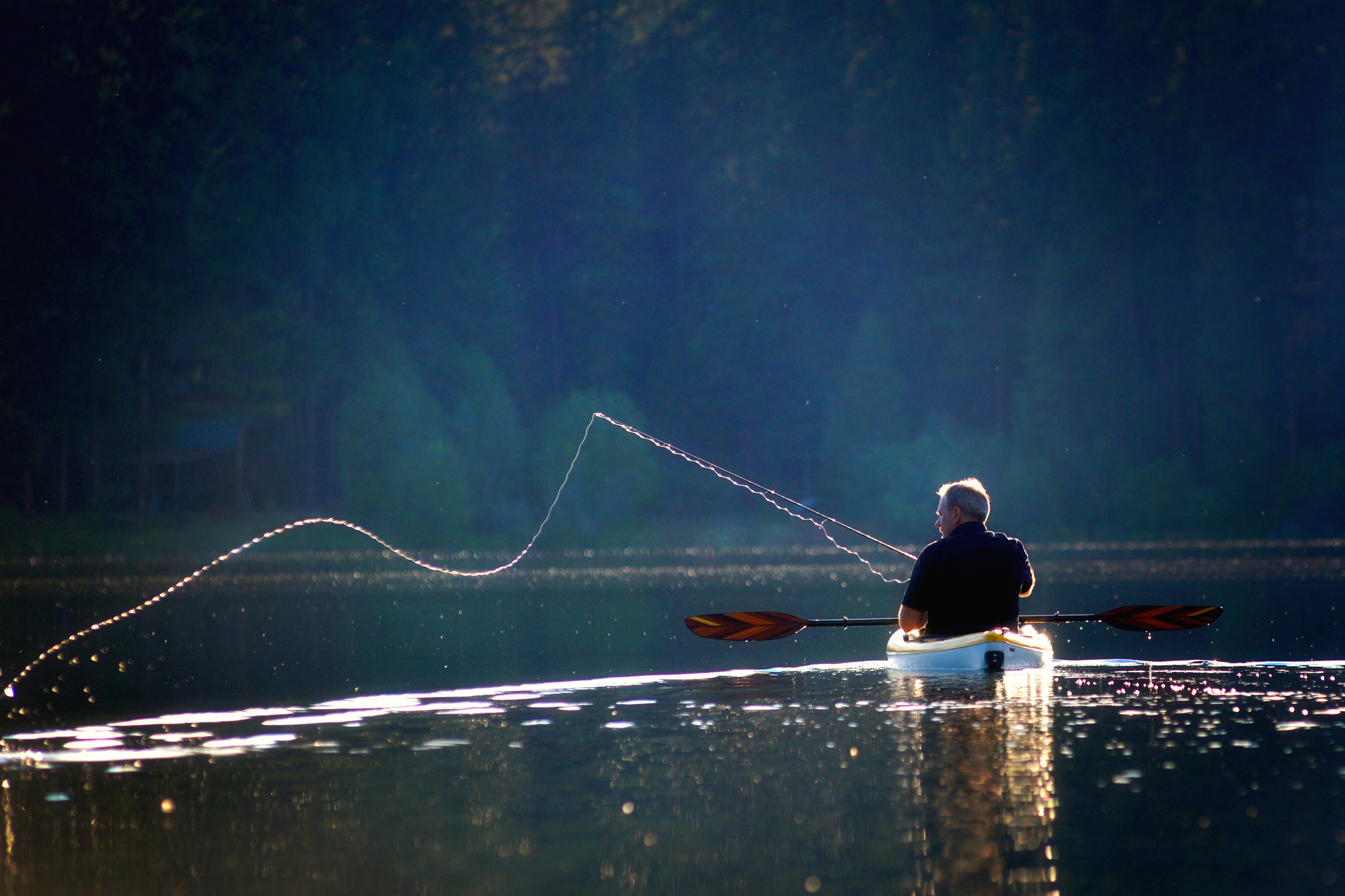 A man Kayak Fishing