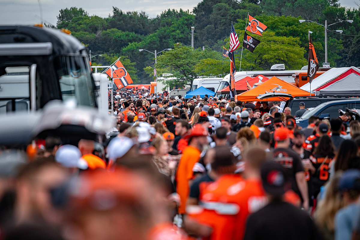 Fans in orange jerseys.