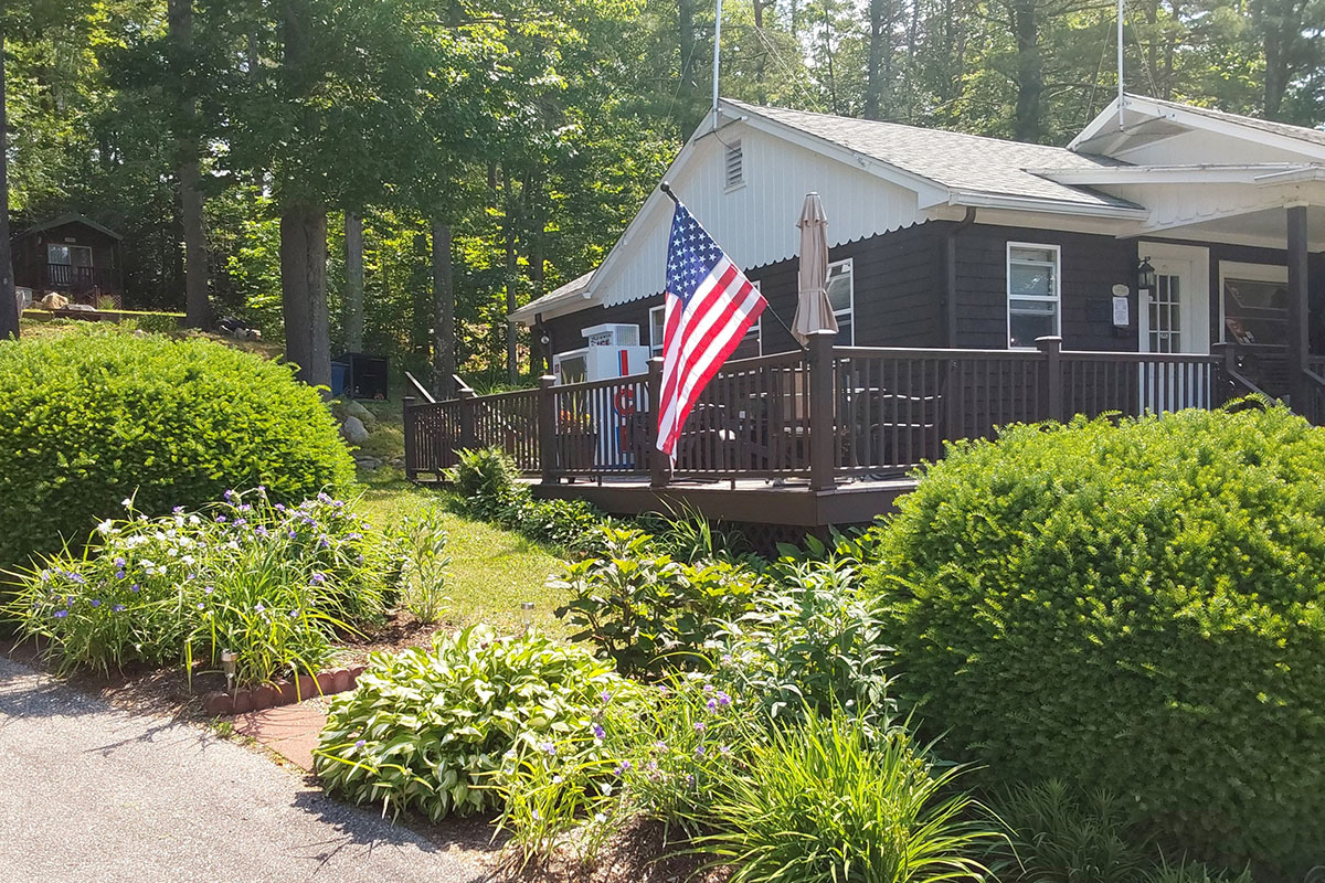 Patio with American flag on railing.